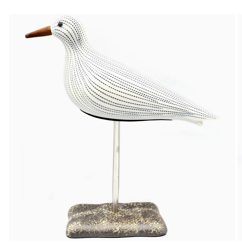 White Seagull With Blue Stripes On A Stand